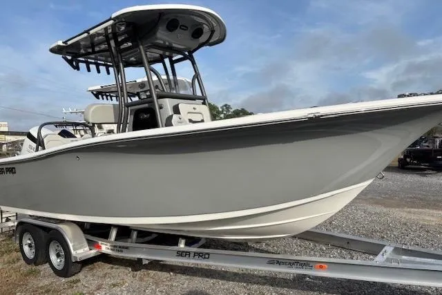 The Image of 2025 Sea Pro 225FLX Sandbar boat on trailer, side view, gray hull. - 1