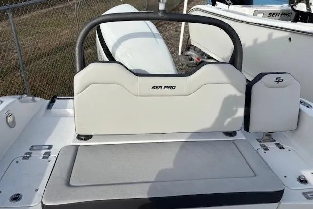 Slide: The Image of 2025 Sea Pro 225FLX Sandbar boat interior with seating and storage. - 4