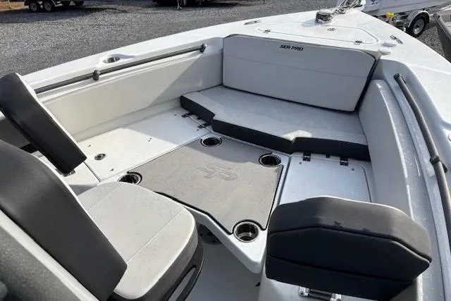 Slide: The Image of 2025 Sea Pro 225FLX Sandbar boat interior with seating and storage compartments. - 6