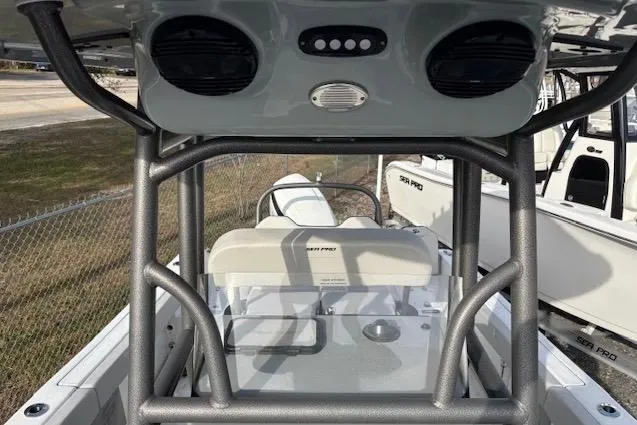 Slide: The Image of 2025 Sea Pro 225FLX Sandbar boat interior with seating and console view. - 9