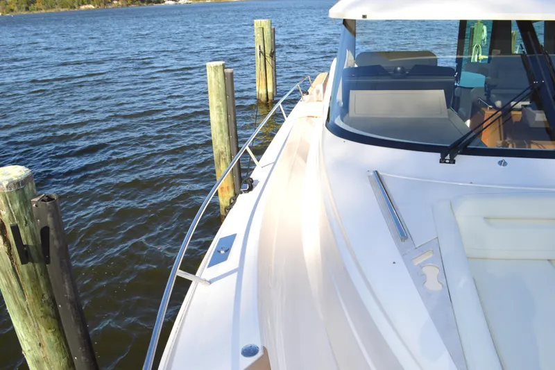 Slide: The Image of 2024 Tiara Yachts EX 60 docked, showcasing sleek design and luxurious deck features. - 15
