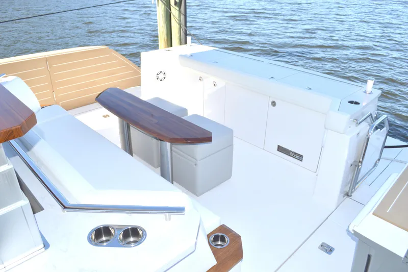 Slide: The Image of 2024 Tiara Yachts EX 60 deck with seating and ocean view. - 21