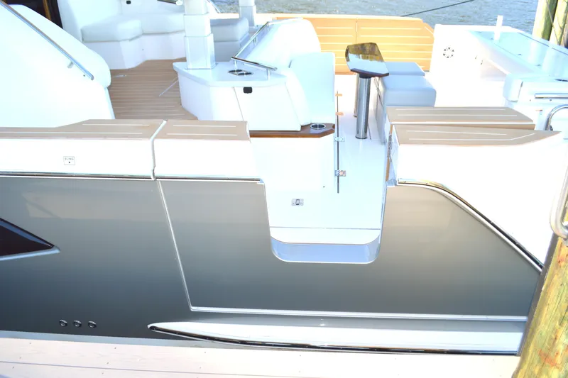 Slide: The Image of 2024 Tiara Yachts EX 60 luxury yacht deck with sleek design and modern amenities. - 26