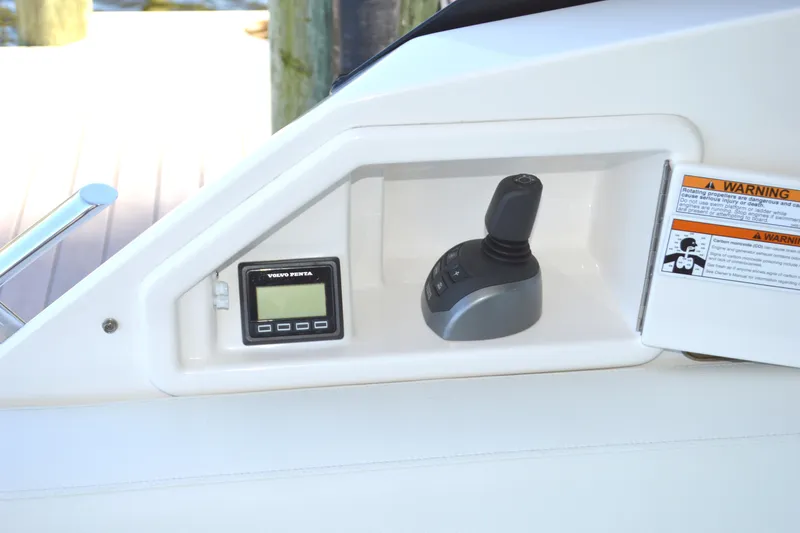 Slide: The Image of Control panel of 2024 Tiara Yachts EX 60 with joystick and Volvo Penta display. - 35