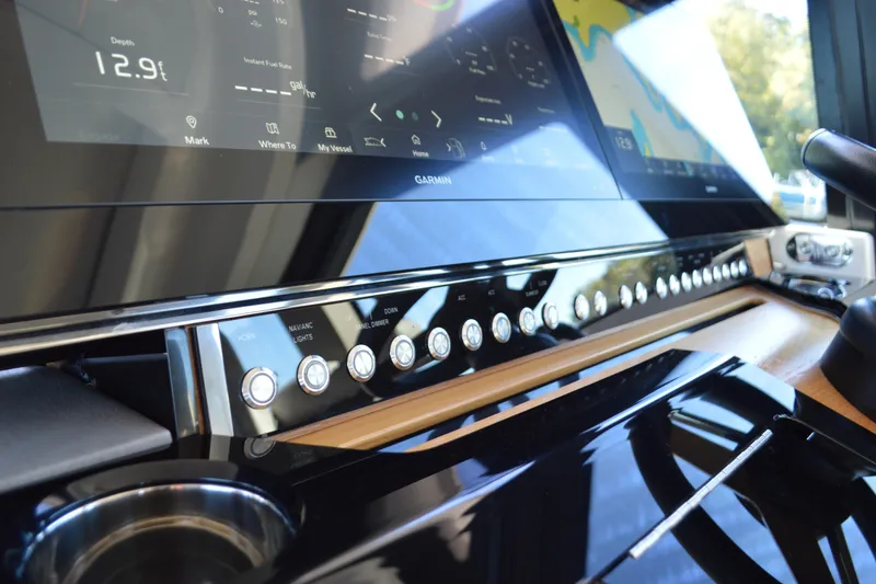 Slide: The Image of 2024 Tiara Yachts EX 60 dashboard with advanced navigation controls and digital displays. - 42