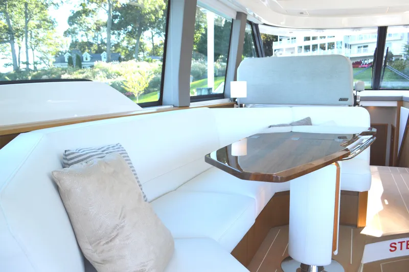 Slide: The Image of Luxurious interior of 2024 Tiara Yachts EX 60 with elegant seating and wooden table. - 47