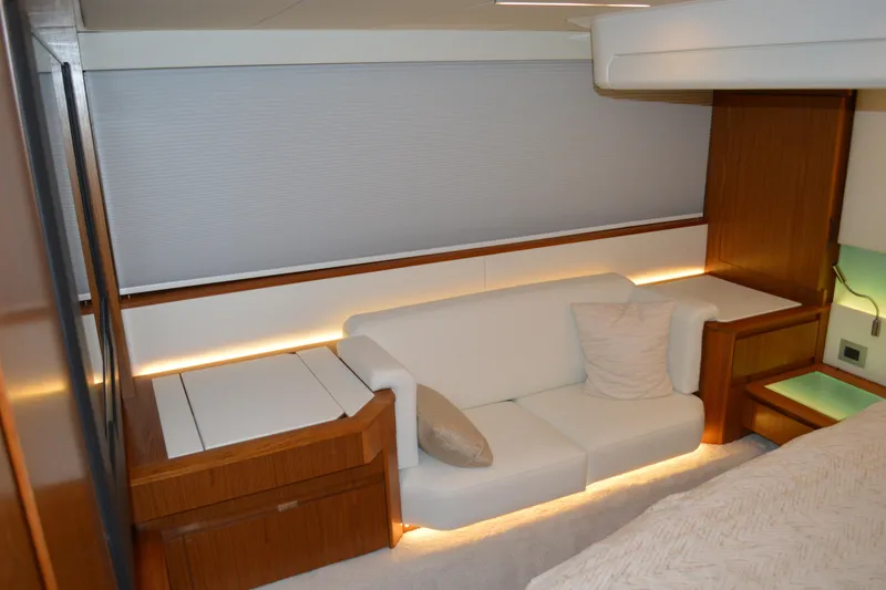 Slide: The Image of Luxurious interior of 2024 Tiara Yachts EX 60 with elegant white sofa and wooden accents. - 62