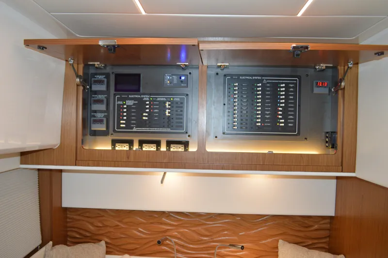 Slide: The Image of Electrical panel inside 2024 Tiara Yachts EX 60, featuring modern control systems. - 84