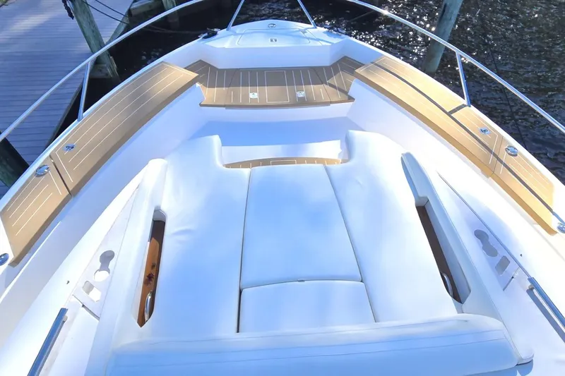 Slide: The Image of 2024 Tiara Yachts EX 60 deck with luxurious seating and sleek design. - 9