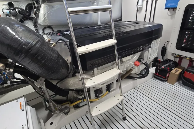 Slide: The Image of Engine room of 2024 Tiara Yachts EX 60 with ladder and equipment. - 91
