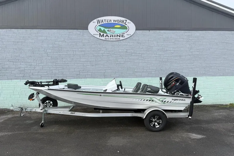 The Image of 2026 Xpress H18 boat on trailer outside Water Workz Marine. - 1