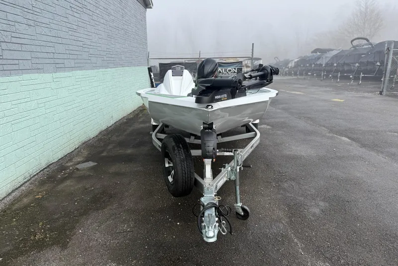 Slide: The Image of 2026 Xpress H18 boat on trailer in foggy outdoor setting. - 3