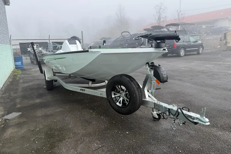 Slide: The Image of 2026 Xpress H18 boat on trailer in foggy outdoor setting. - 4