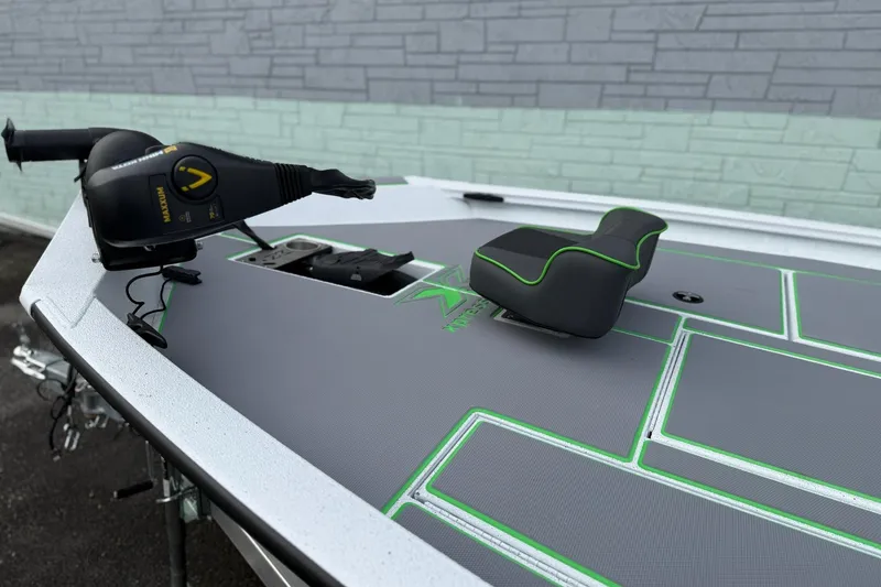 Slide: The Image of 2026 Xpress H18 boat deck with trolling motor and cushioned seat. - 5