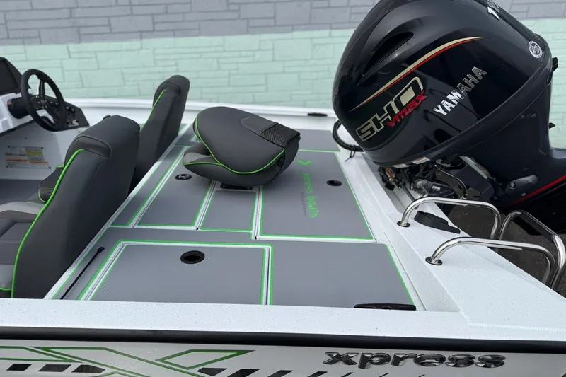 Slide: The Image of 2026 Xpress H18 boat with Yamaha engine, featuring sleek seating and modern design. - 9