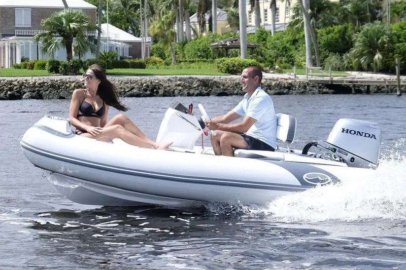 Slide: The Image of Manufacturer Provided Image: 2020 Walker Bay Generation 11 LTE inflatable boat cruising on water. - 6