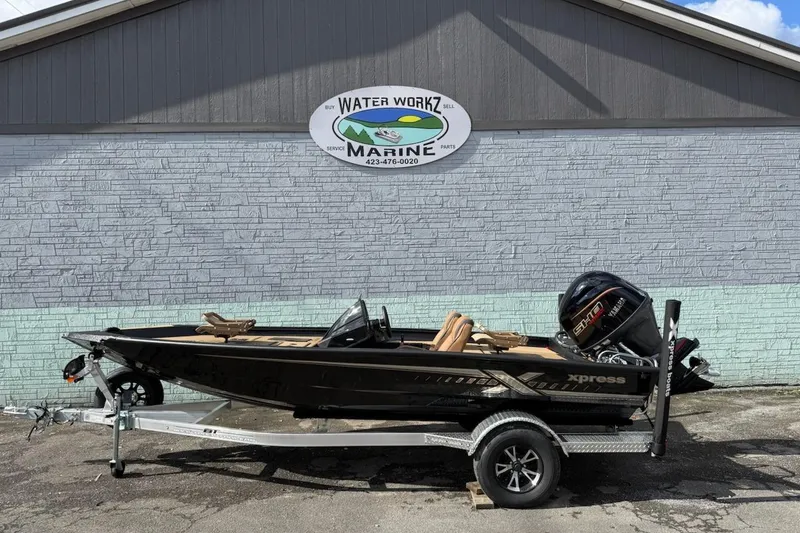 The Image of 2026 Xpress H18C Crappie boat on trailer outside Water Workz Marine. - 1