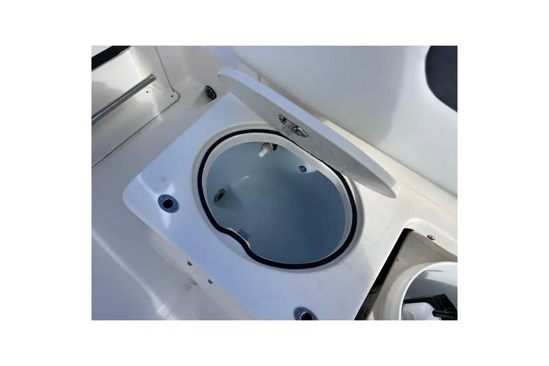 Slide: The Image of Open livewell on 2019 Robalo R222 Explorer boat, showcasing interior design. - 15