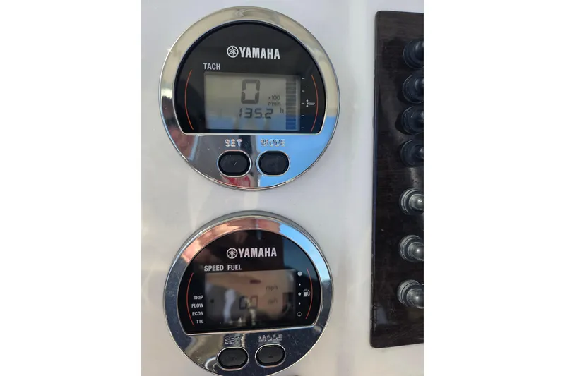 Slide: The Image of Yamaha gauges on 2019 Robalo R222 Explorer boat dashboard, displaying tachometer and speed fuel data. - 21