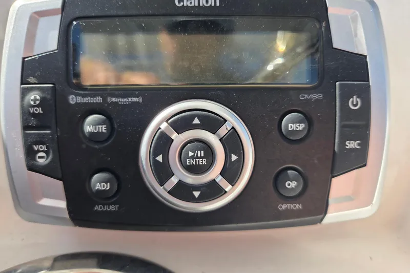 Slide: The Image of Clarion CMS2 marine stereo system on 2019 Robalo R222 Explorer boat dashboard. - 23