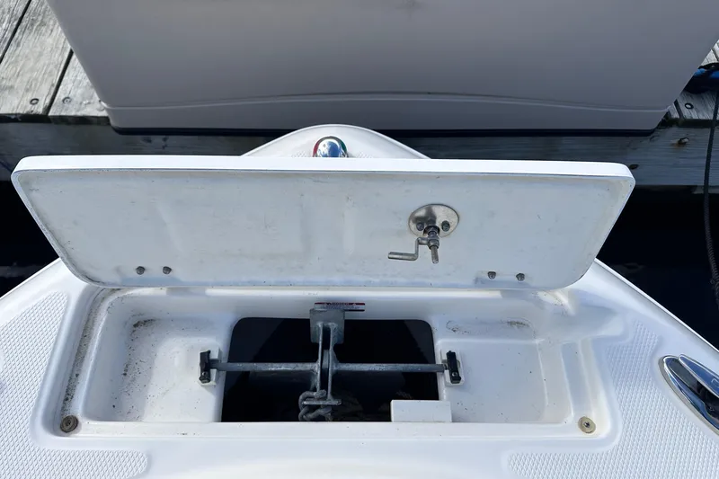 Slide: The Image of Open anchor compartment on 2019 Robalo R222 Explorer boat. - 28