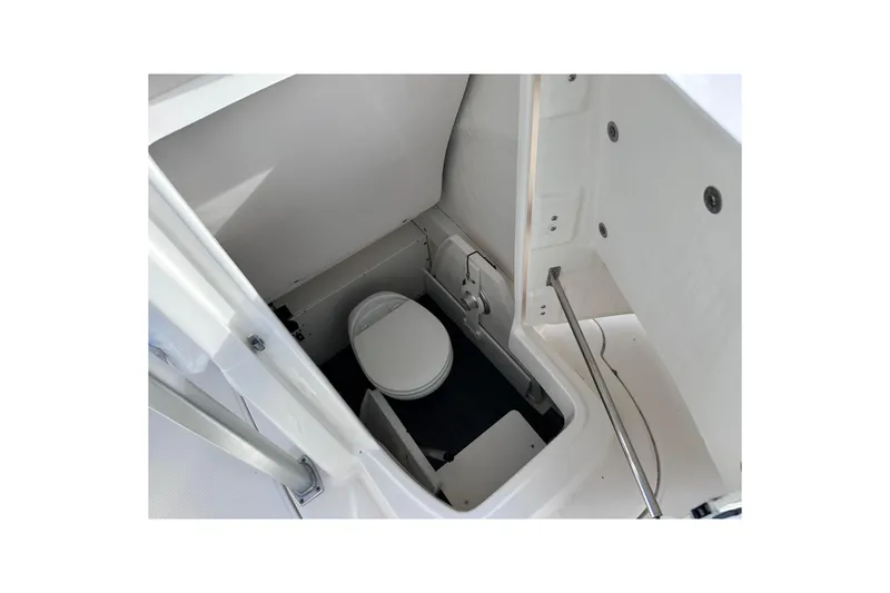 Slide: The Image of 2019 Robalo R222 Explorer boat interior with compact marine toilet. - 31