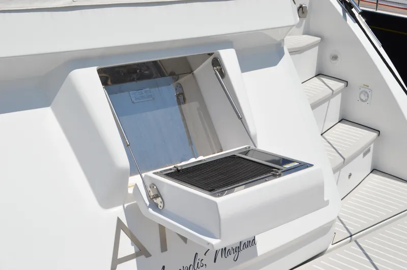 Slide: The Image of 2019 Azimut Atlantis 51 yacht with built-in outdoor grill on deck. - 11