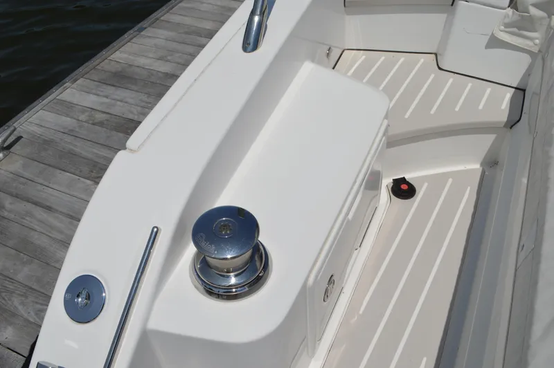 Slide: The Image of 2019 Azimut Atlantis 51 yacht deck with sleek white design and dock view. - 14