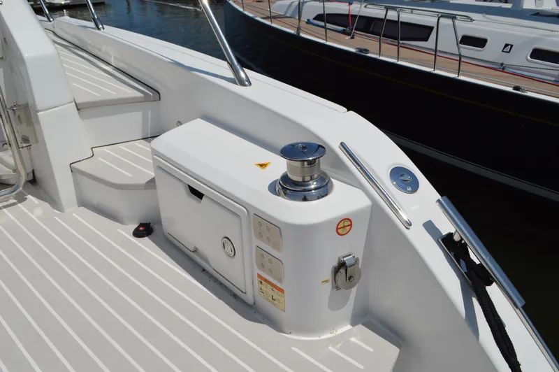 Slide: The Image of 2019 Azimut Atlantis 51 yacht deck with winch and storage compartment. - 16