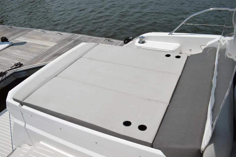 Slide: The Image of 2019 Azimut Atlantis 51 yacht with spacious sunbathing area by the water. - 17