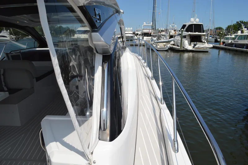 Slide: The Image of 2019 Azimut Atlantis 51 yacht docked in marina, showcasing sleek design and luxurious features. - 20