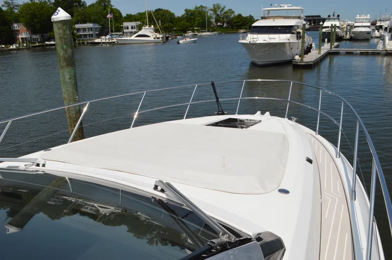 Slide: The Image of 2019 Azimut Atlantis 51 yacht docked in a marina with surrounding boats. - 22