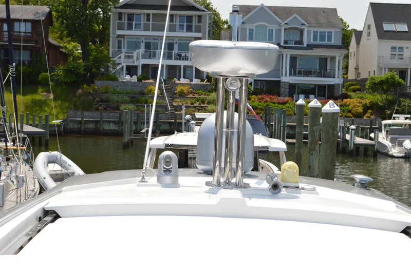 Slide: The Image of 2019 Azimut Atlantis 51 yacht docked near waterfront homes. - 30