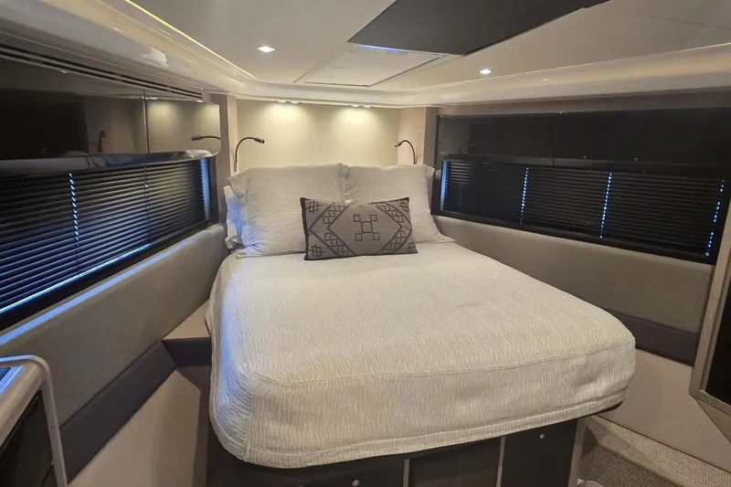 Slide: The Image of Luxurious bedroom interior of 2019 Azimut Atlantis 51 yacht with modern design and cozy bedding. - 60