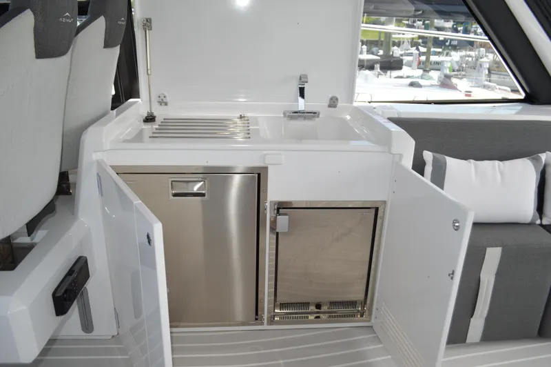 Slide: The Image of 2019 Azimut Atlantis 51 yacht interior with kitchenette and seating area. - 37
