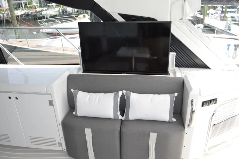 Slide: The Image of Luxury seating area on 2019 Azimut Atlantis 51 yacht with TV and cushions. - 39