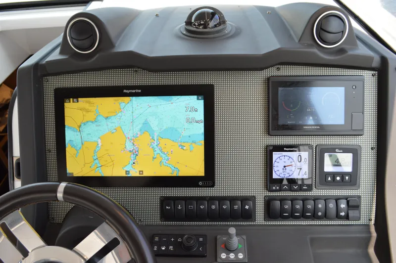 Slide: The Image of Control panel of 2019 Azimut Atlantis 51 yacht with navigation and monitoring displays. - 47