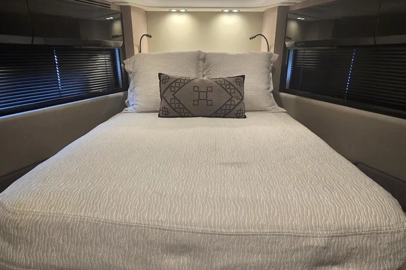 Slide: The Image of Luxurious bedroom interior of 2019 Azimut Atlantis 51 yacht with elegant bedding and ambient lighting. - 59