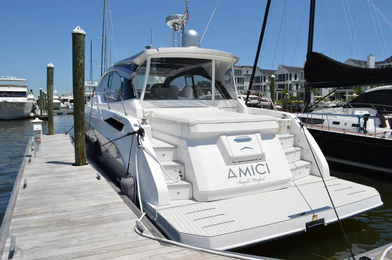 Slide: The Image of 2019 Azimut Atlantis 51 yacht docked at marina, showcasing sleek design and luxury features. - 9