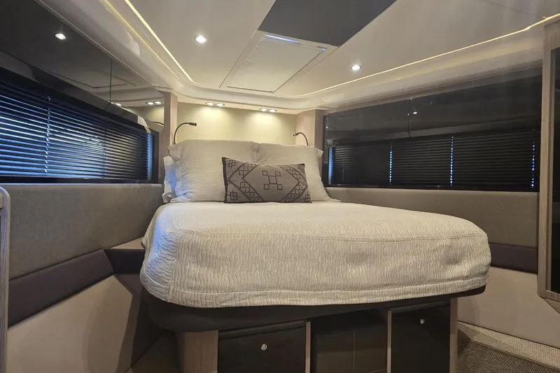 Slide: The Image of Luxurious bedroom interior of 2019 Azimut Atlantis 51 yacht with modern design and cozy bedding. - 58