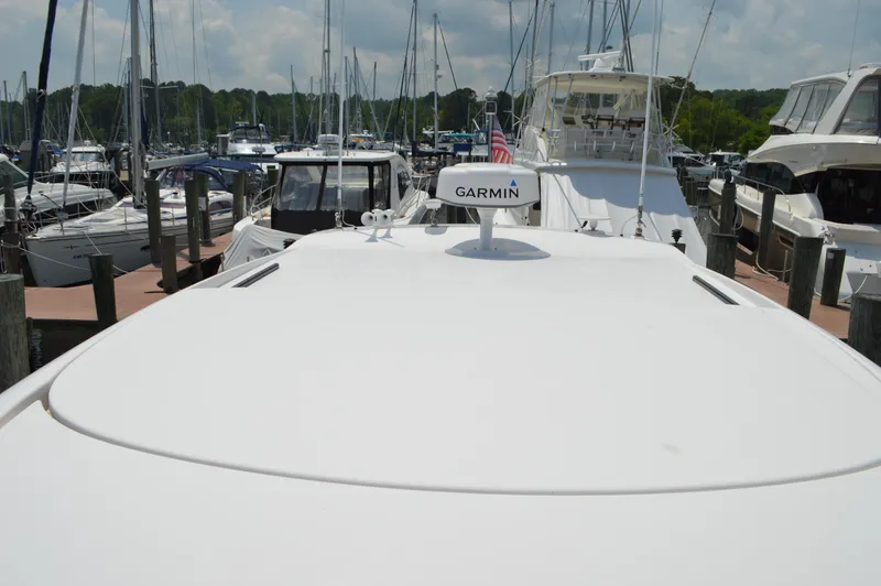 Slide: The Image of 2019 Tiara Yachts C39 Coupe docked, featuring Garmin equipment, surrounded by other boats. - 13