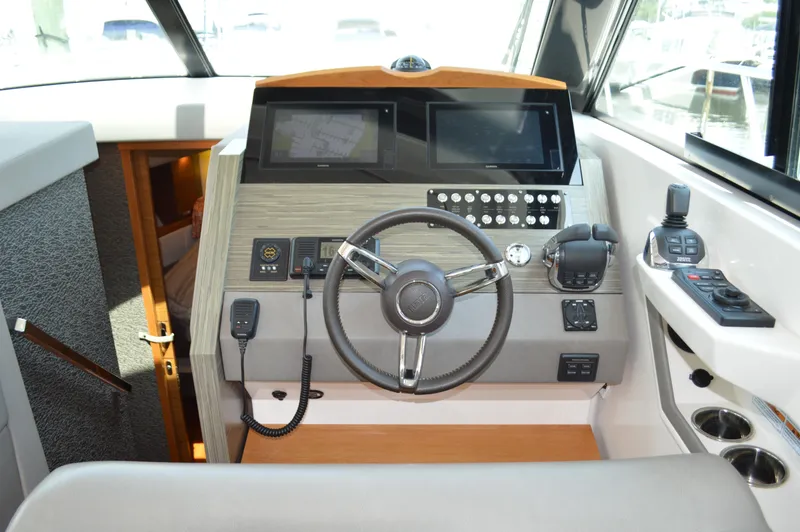 Slide: The Image of Helm of 2019 Tiara Yachts C39 Coupe with modern controls and navigation equipment. - 37
