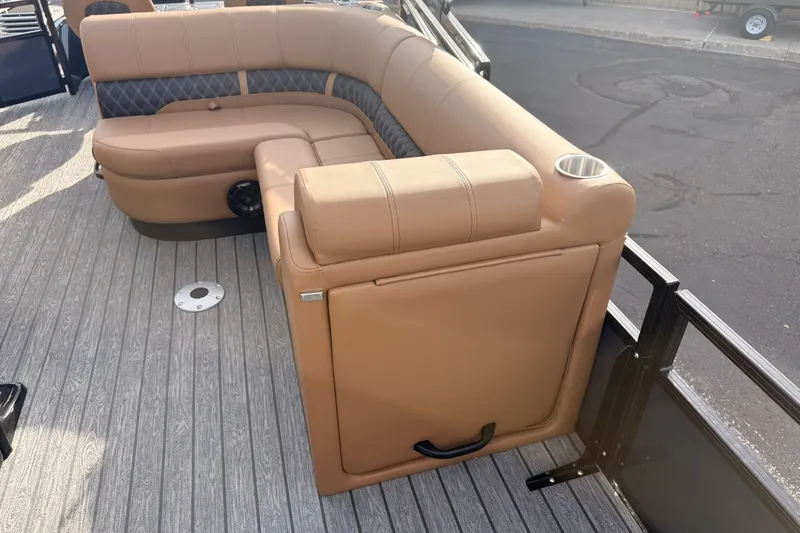 Slide: The Image of Luxurious seating on 2026 Ranger 220F boat with tan upholstery and cup holder. - 15