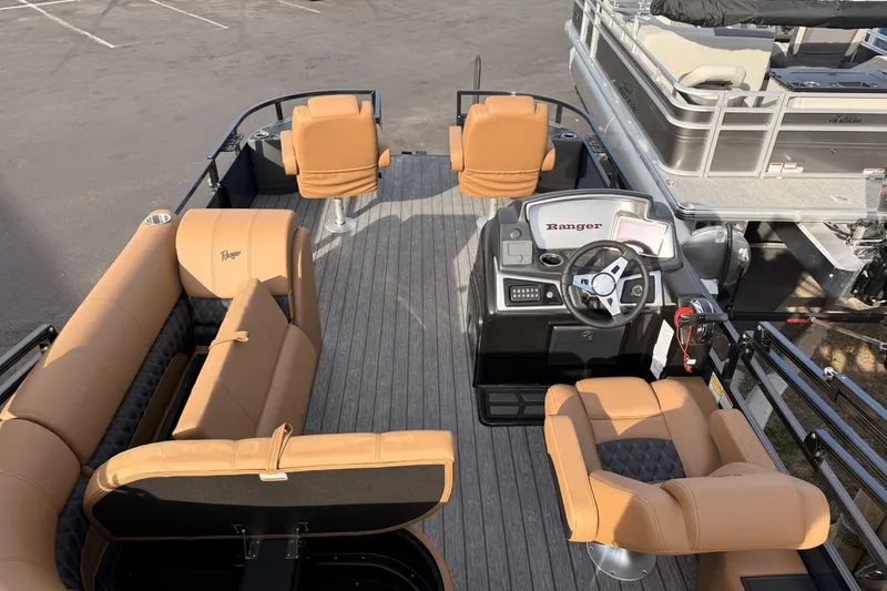 Slide: The Image of 2026 Ranger 220F boat interior with tan seating and steering console. - 17