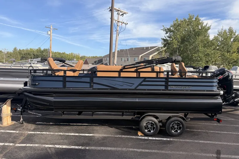 The Image of 2026 Ranger 220F pontoon boat on trailer, parked outdoors under clear sky. - 3