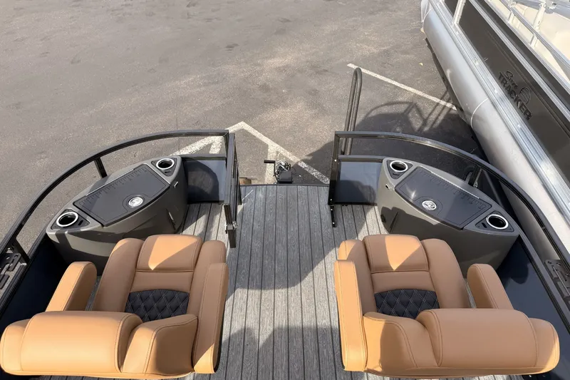 Slide: The Image of 2026 Ranger 220F boat interior with tan seats and sleek design. - 7