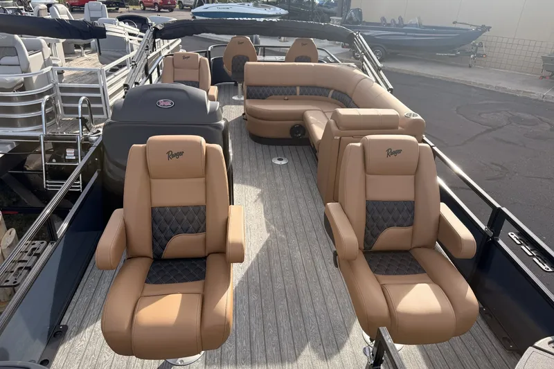 Slide: The Image of 2026 Ranger 220F boat interior with luxurious tan seating and modern design. - 6