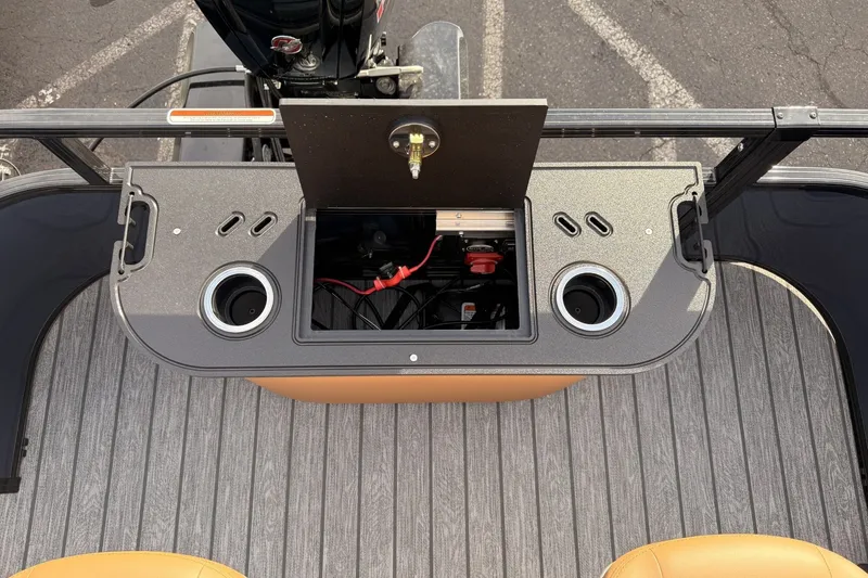 Slide: The Image of 2026 Ranger 220F boat console with storage compartment and cup holders. - 10