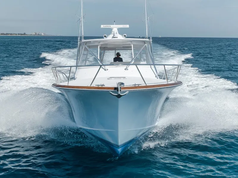 Slide: The Image of 2012 Spencer Yachts Express cruising on open water, showcasing sleek design and powerful performance. - 10