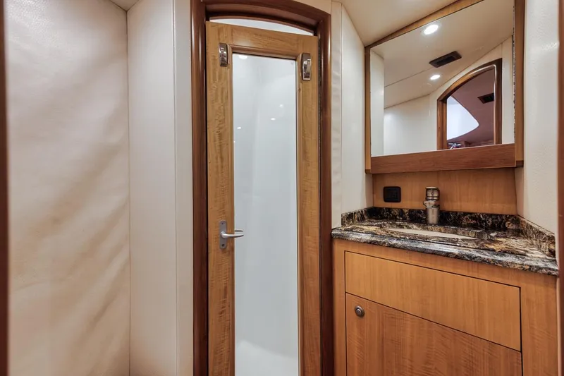 Slide: The Image of Luxurious interior of 2012 Spencer Yachts Express with kitchen and seating area. - 28